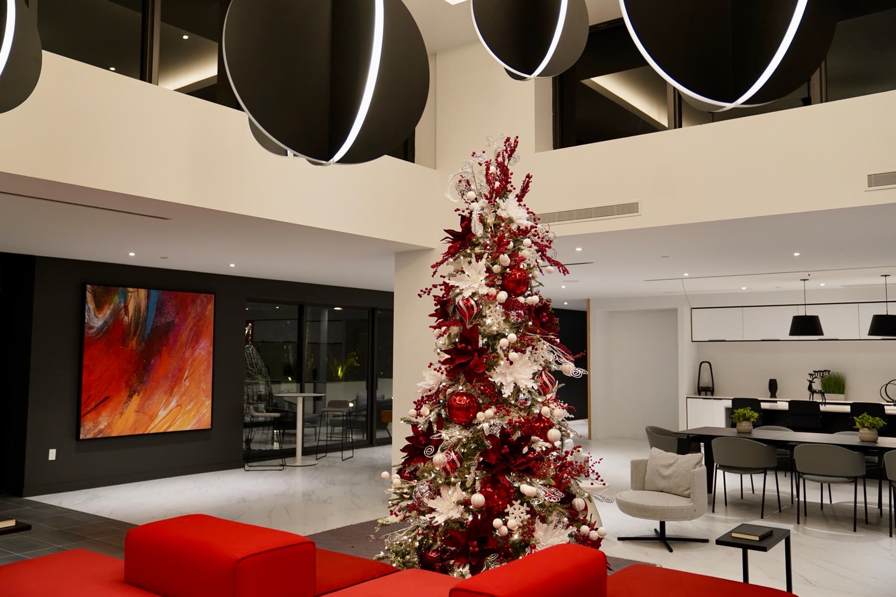 A red and white commission by Johan Nova in a double-height living room