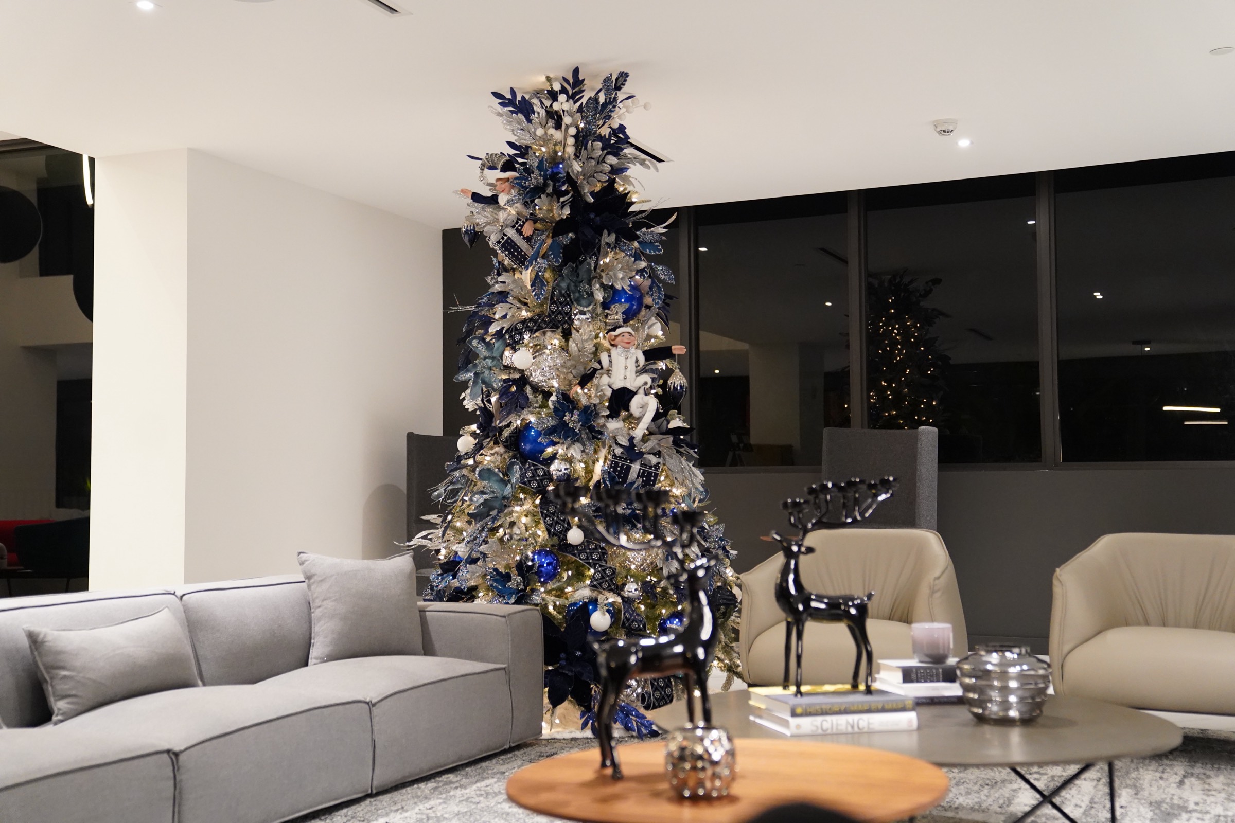 Blue and silver tree in a living room